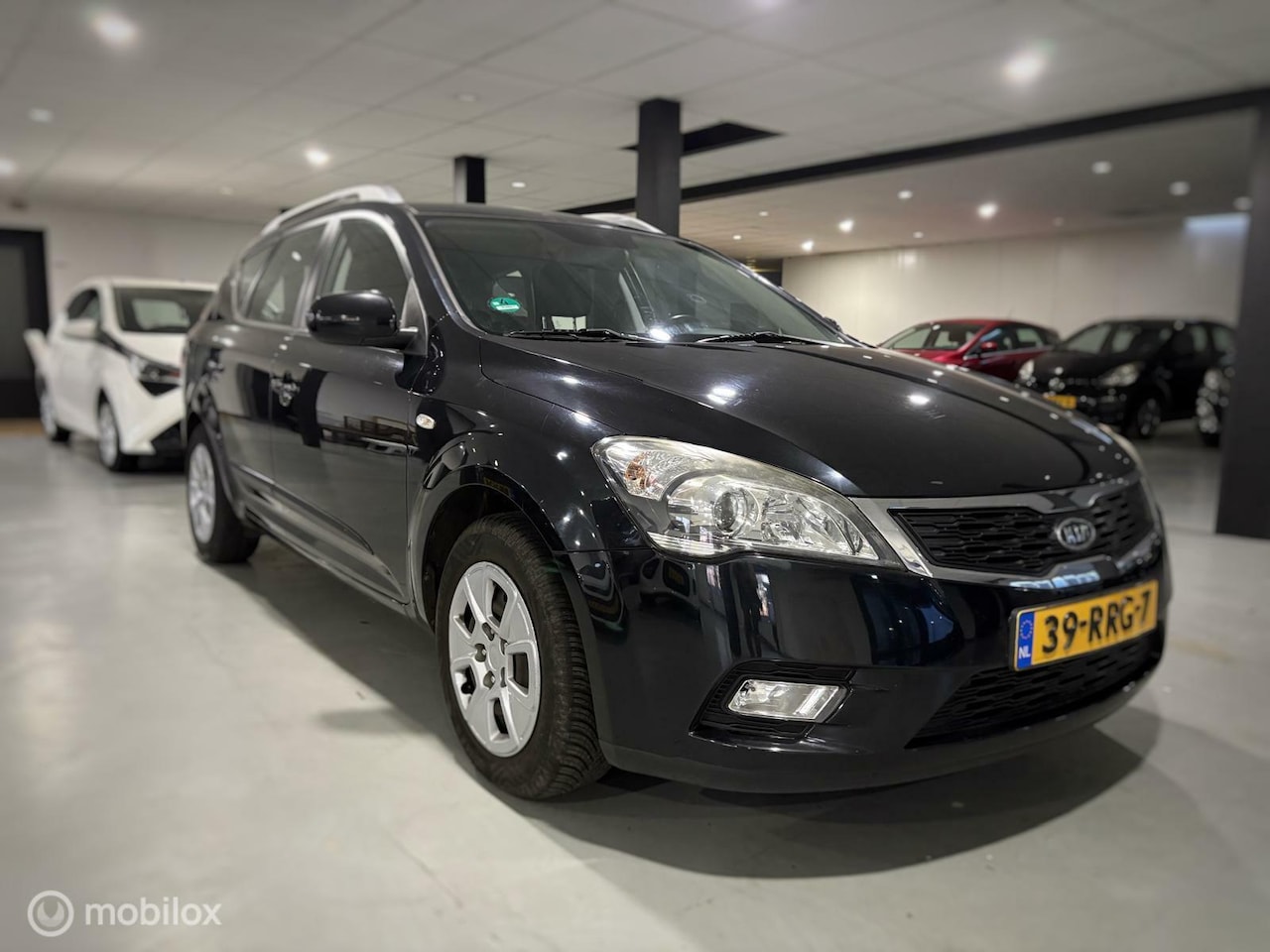 Kia Cee'd Sporty Wagon - 1.4 CVVT Seven 1.4 CVVT Seven - AutoWereld.nl