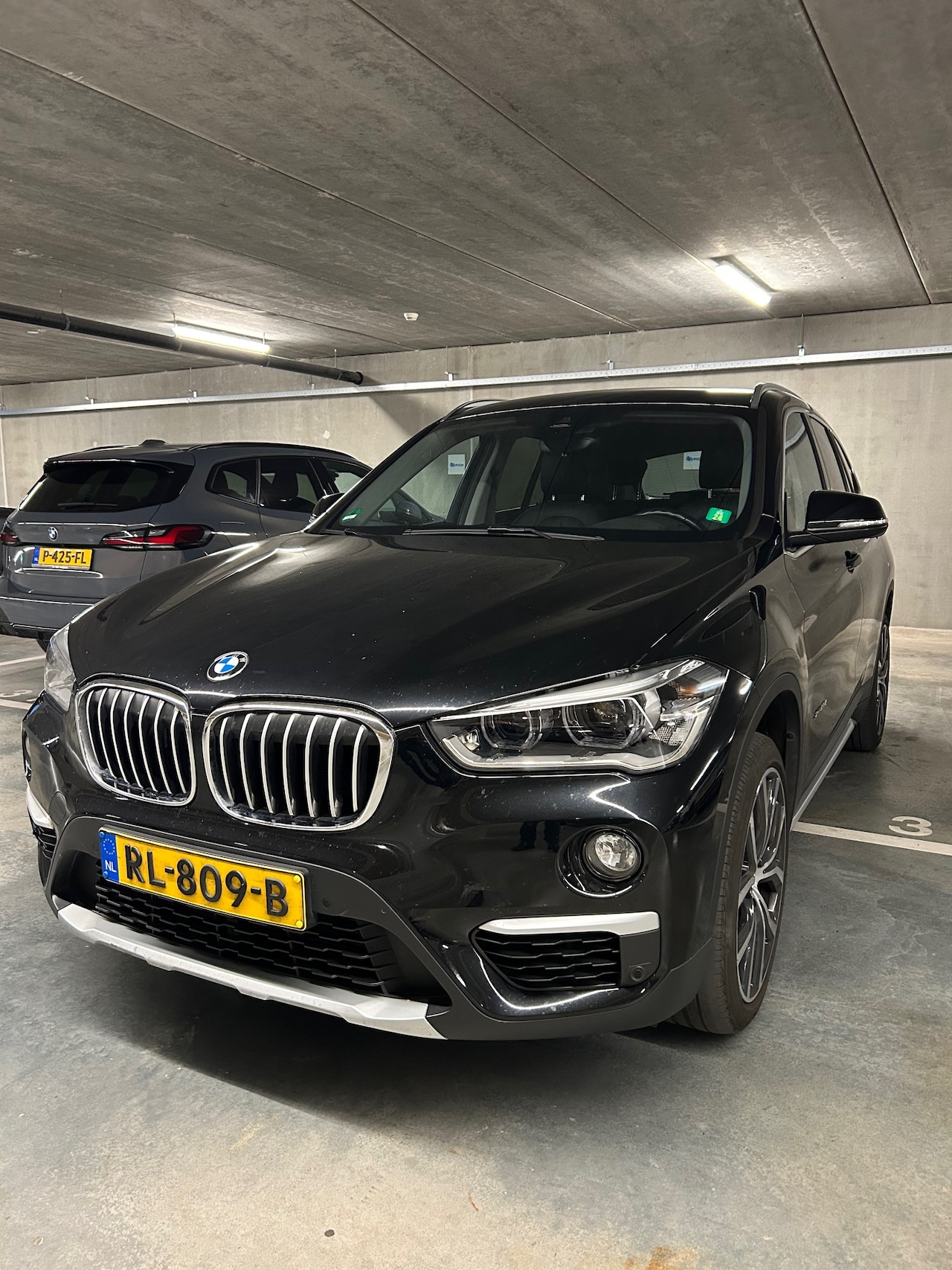 BMW X1 - 2.0i xDrive High Executive Orange Edition - AutoWereld.nl