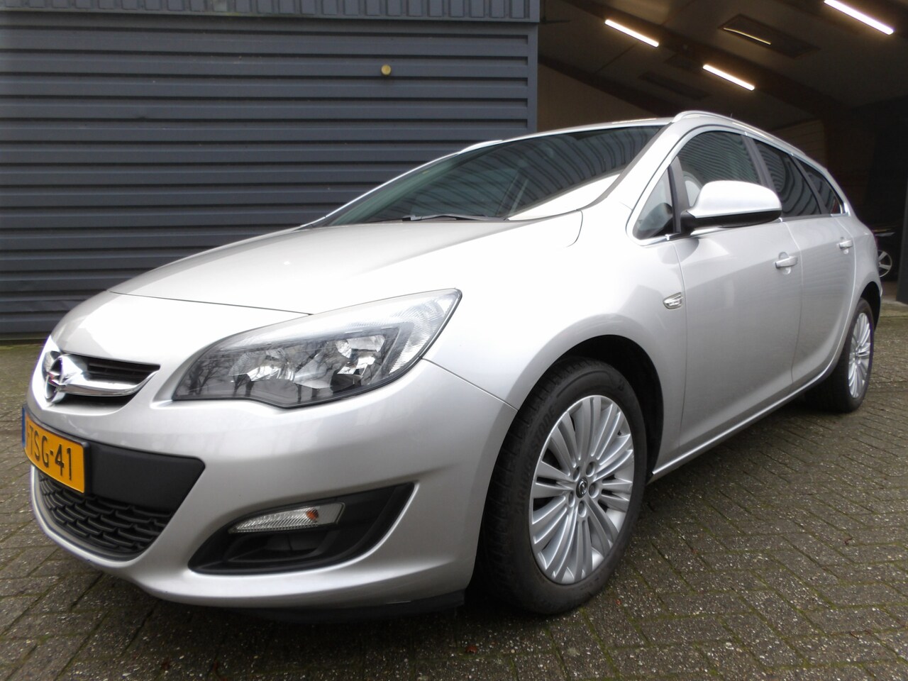 Opel Astra Sports Tourer - 1.4 Turbo Berlin Cruise Control Airco Trekhaak - AutoWereld.nl