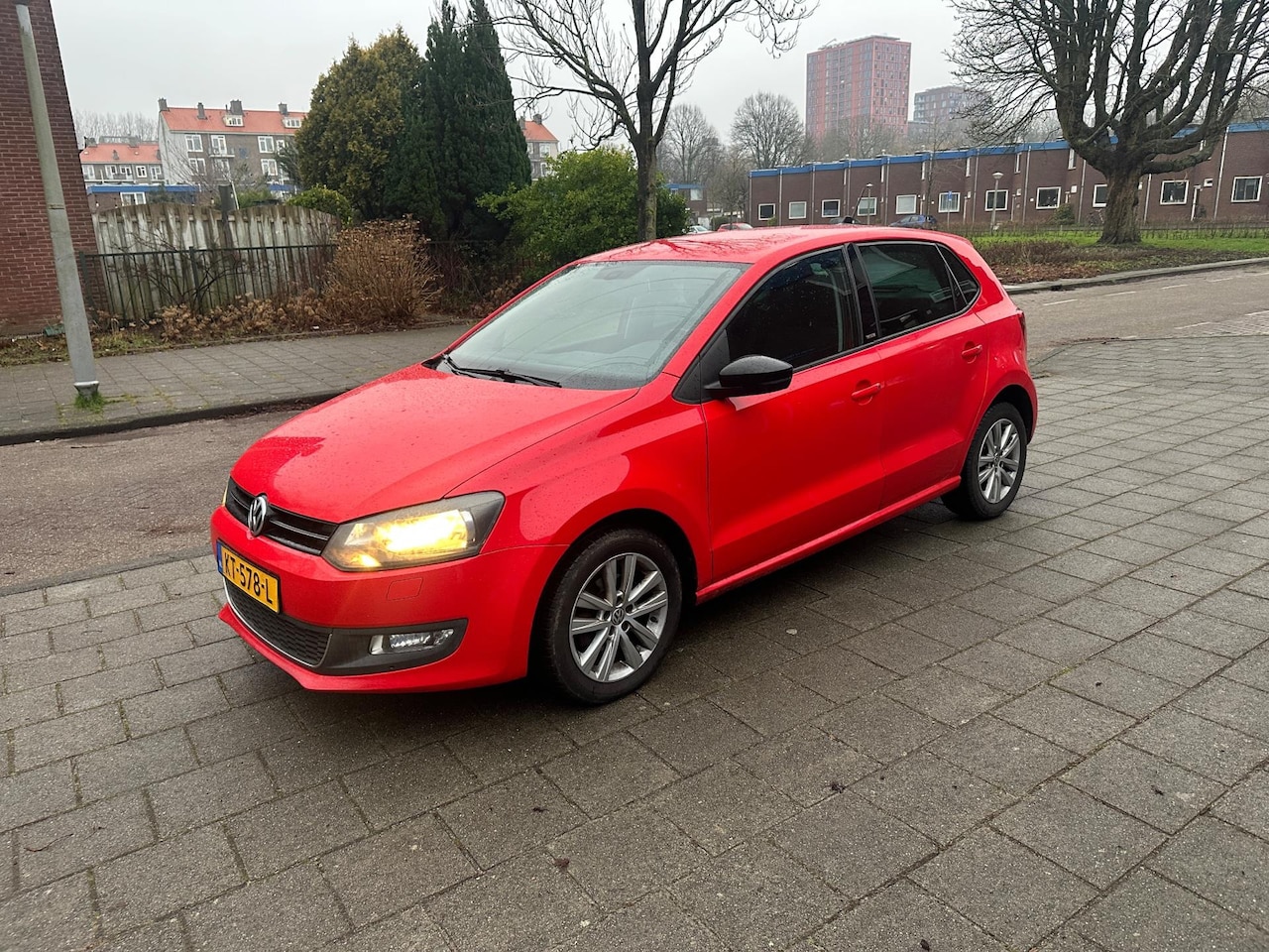 Volkswagen Polo - 1.2 TSI Highline 5drs Airco NAVI Tornado Red - AutoWereld.nl