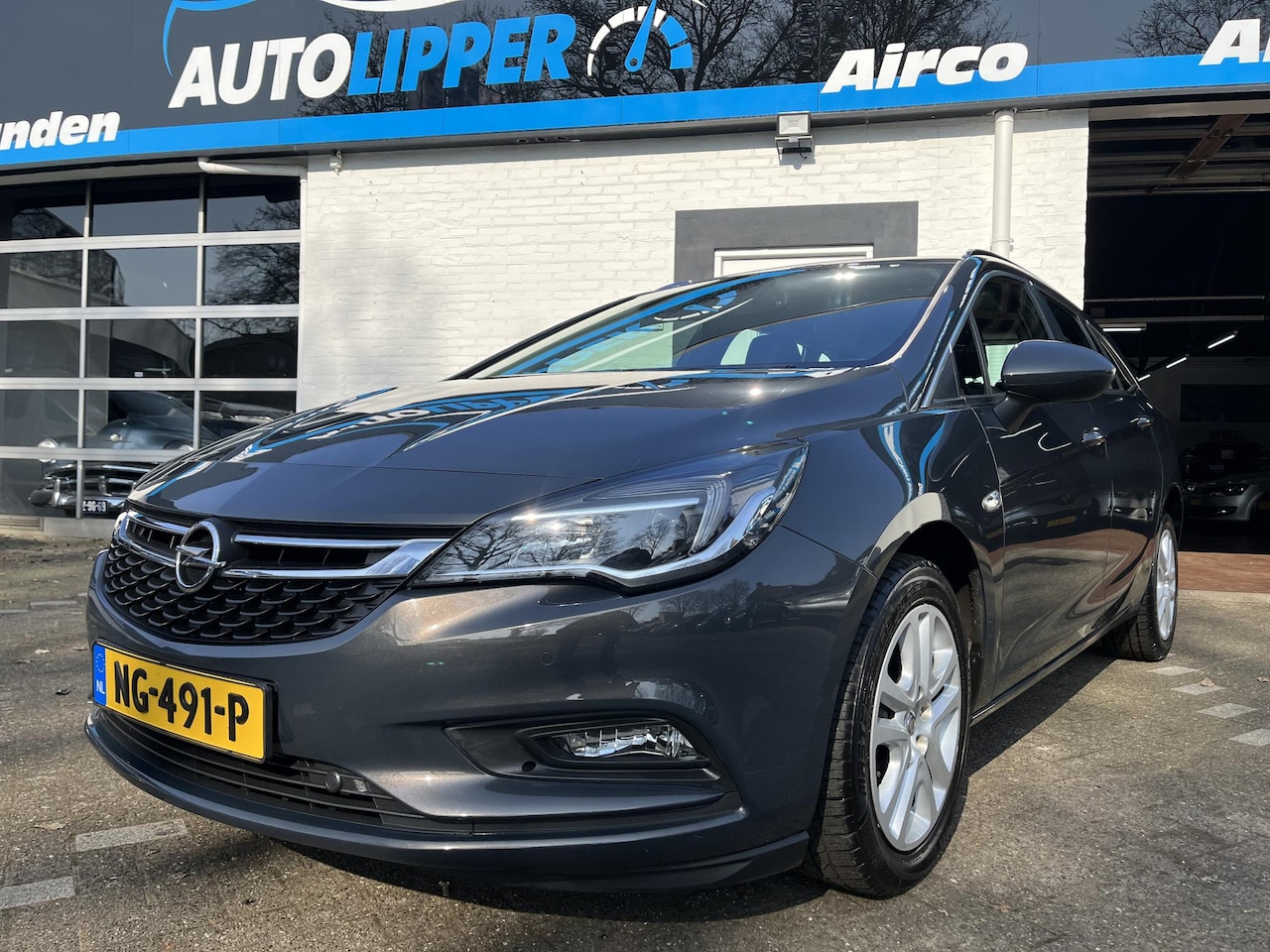 Opel Astra Sports Tourer - 1.0 Business+ /Airco/Navi/All season banden/Lm velgen - AutoWereld.nl