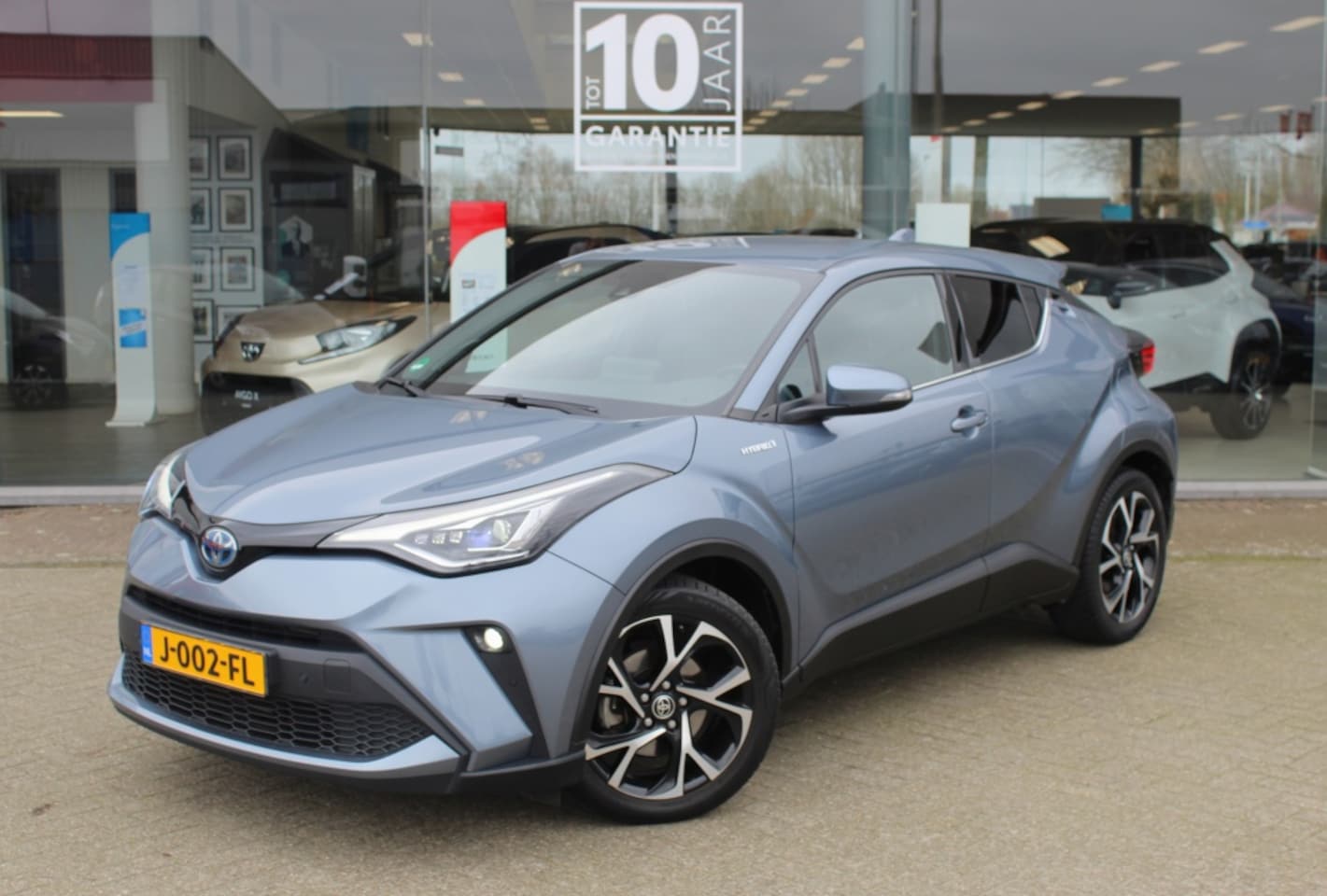 Toyota C-HR - 2.0 Hybrid Style | JBL | Navi | Keyless Entry | Sensoren v/a - AutoWereld.nl