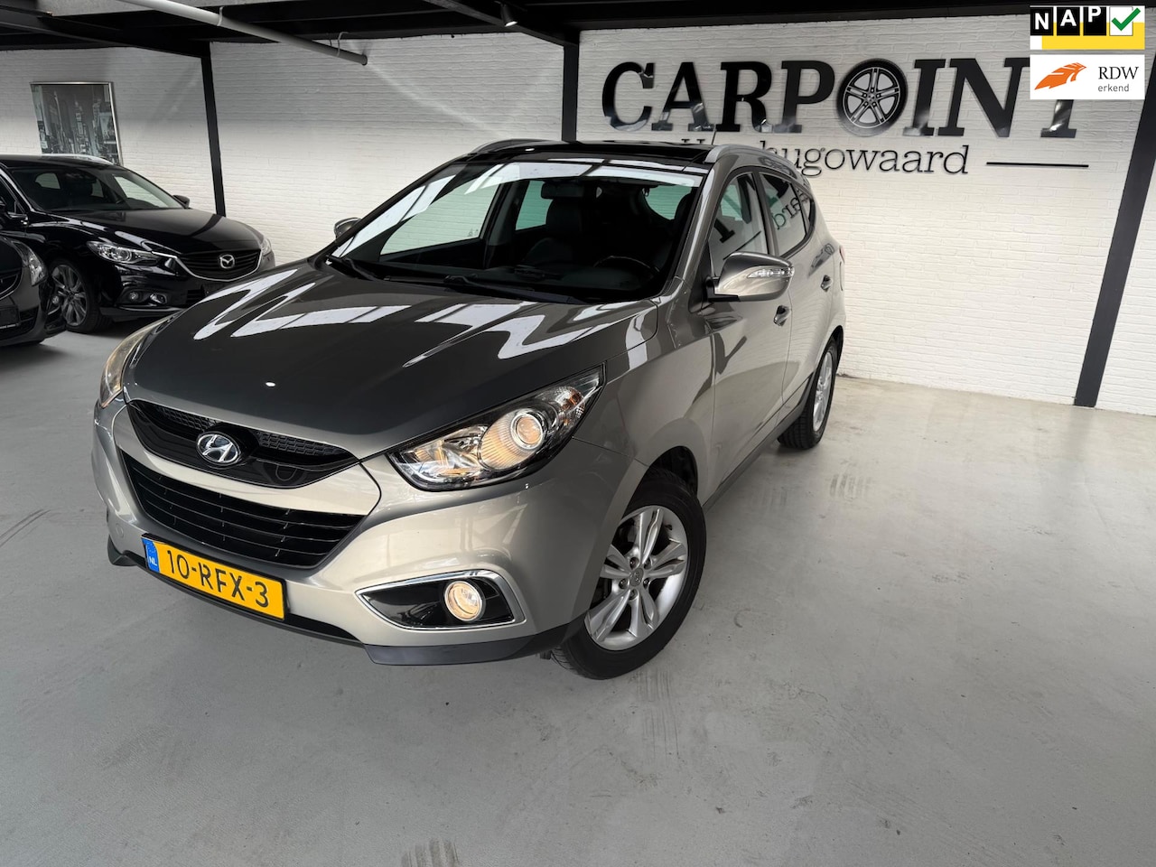 Hyundai ix35 - 2.0i Business Edition 2011 Automaat Pano Camera Navi Cruise Clima Half Leer Dealer O.H NAP - AutoWereld.nl