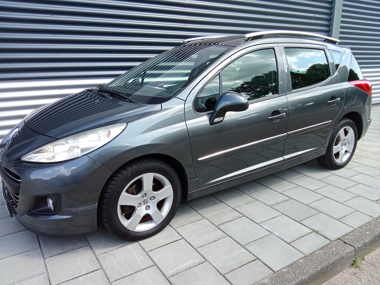 Peugeot 207 SW - 1.6 VTi Première navigatie climatronic cruise control panorama NAP - AutoWereld.nl