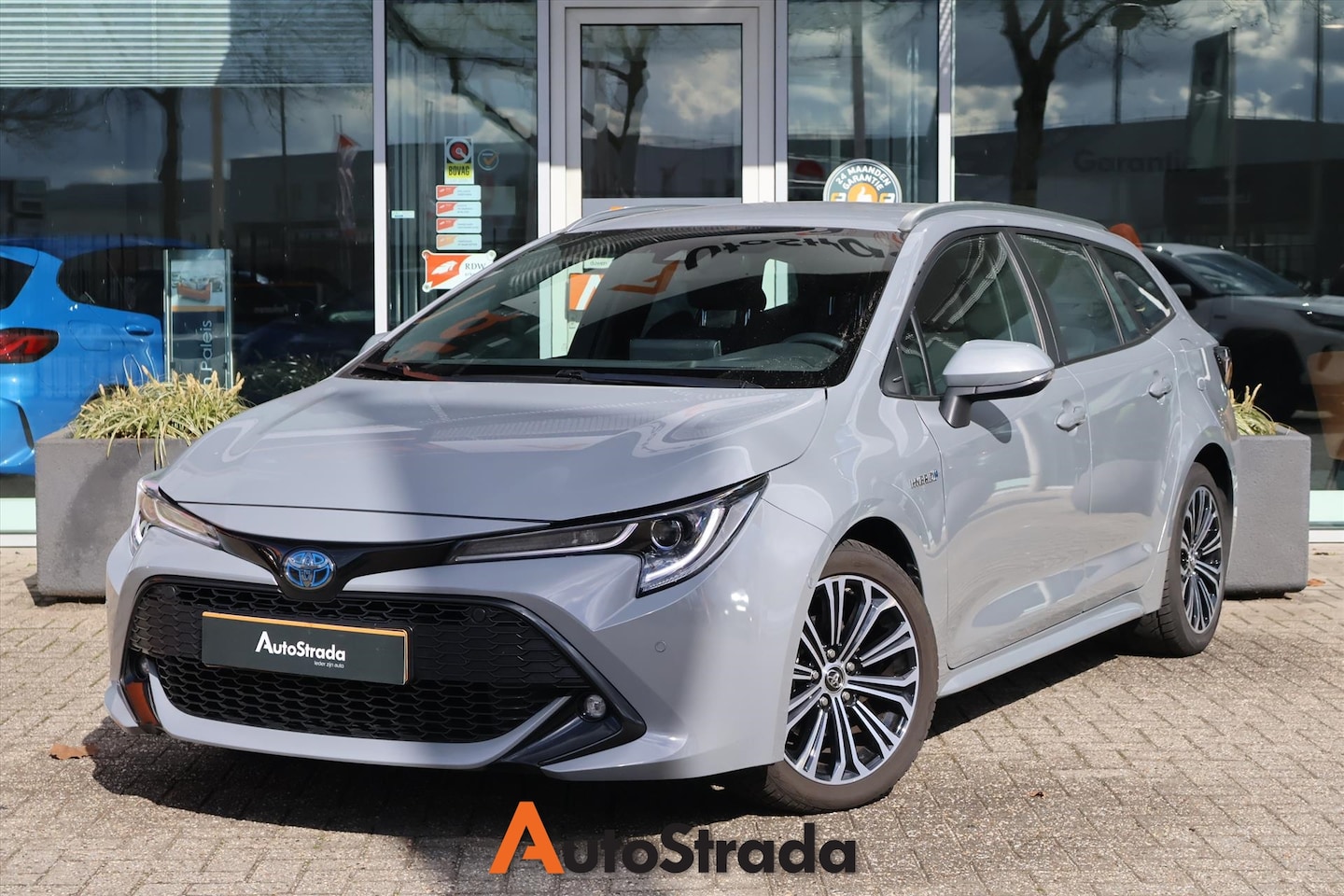 Toyota Corolla Touring Sports - 1.8 Style Hybrid 122pk CVT | Camera | Adaptive | Stoelverwarming | Navi | DAB | Head-Up - AutoWereld.nl