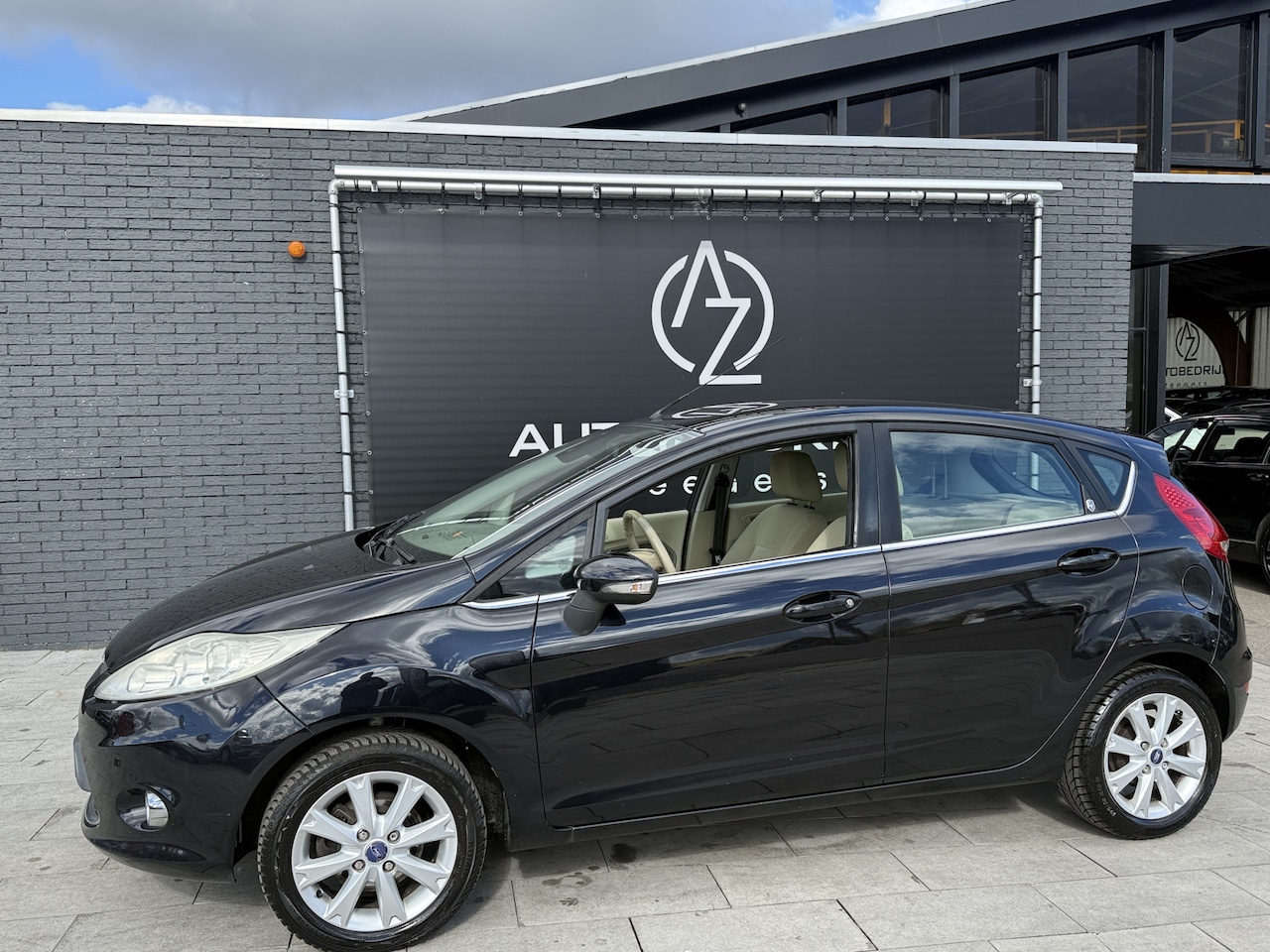 Ford Fiesta - 1.25 Ghia Airco*Navi* - AutoWereld.nl