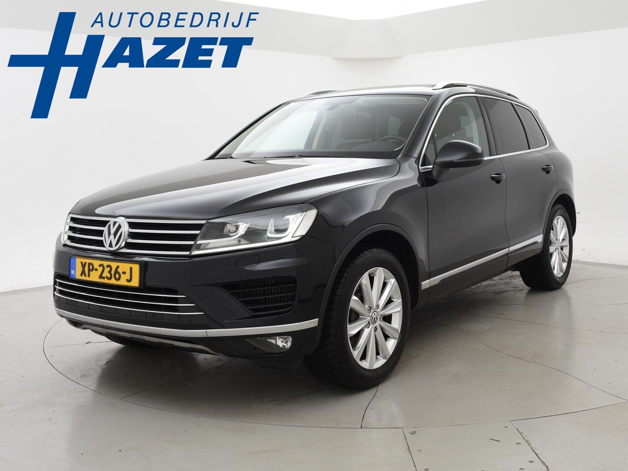 Volkswagen Touareg - 3.0 TDI V6 262 PK HIGHLINE + LUCHTVERING | WEGKL. TREKHAAK | PANORAMA | LEDER - AutoWereld.nl