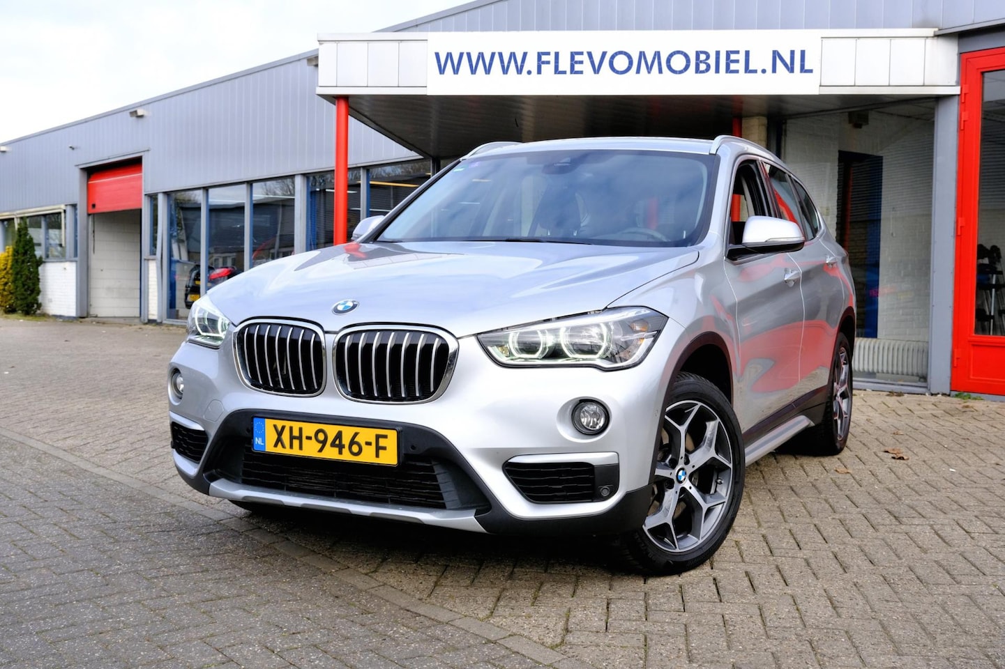 BMW X1 - SDrive20i Orange Edition II Aut. Navi|Leder|Sportstoelen|LMV - AutoWereld.nl