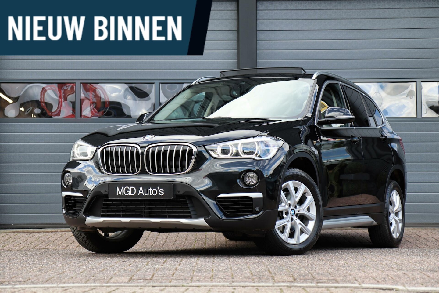 BMW X1 - sDrive18i xLine /LED/PANODAK/KEYLESS/STOEL+STUURVERW./CAMERA/ELEK. KLEP! - AutoWereld.nl