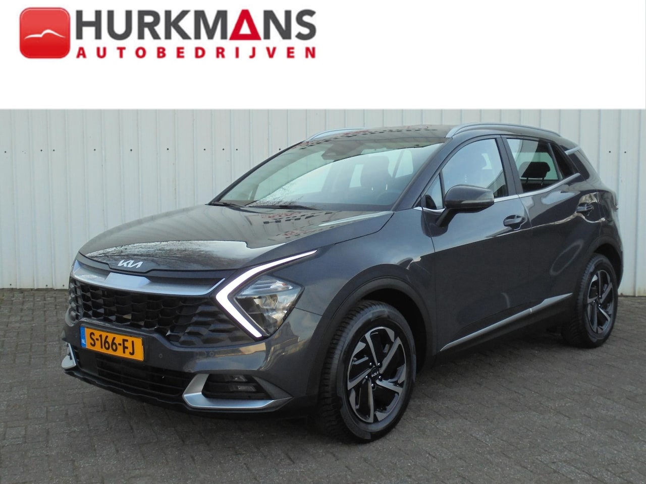 Kia Sportage - 1.6 T-GDi 230PK HYBRIDE DYNAMICLINE TREKHAAK - AutoWereld.nl