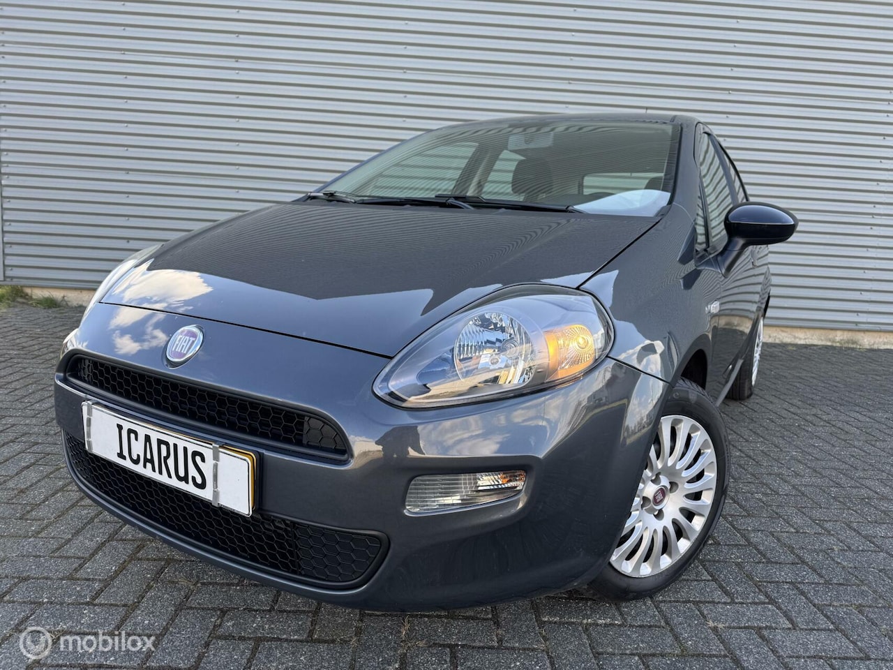 Fiat Punto Evo - 0.9 TwinAir Lounge new apk|airco|cruise| - AutoWereld.nl