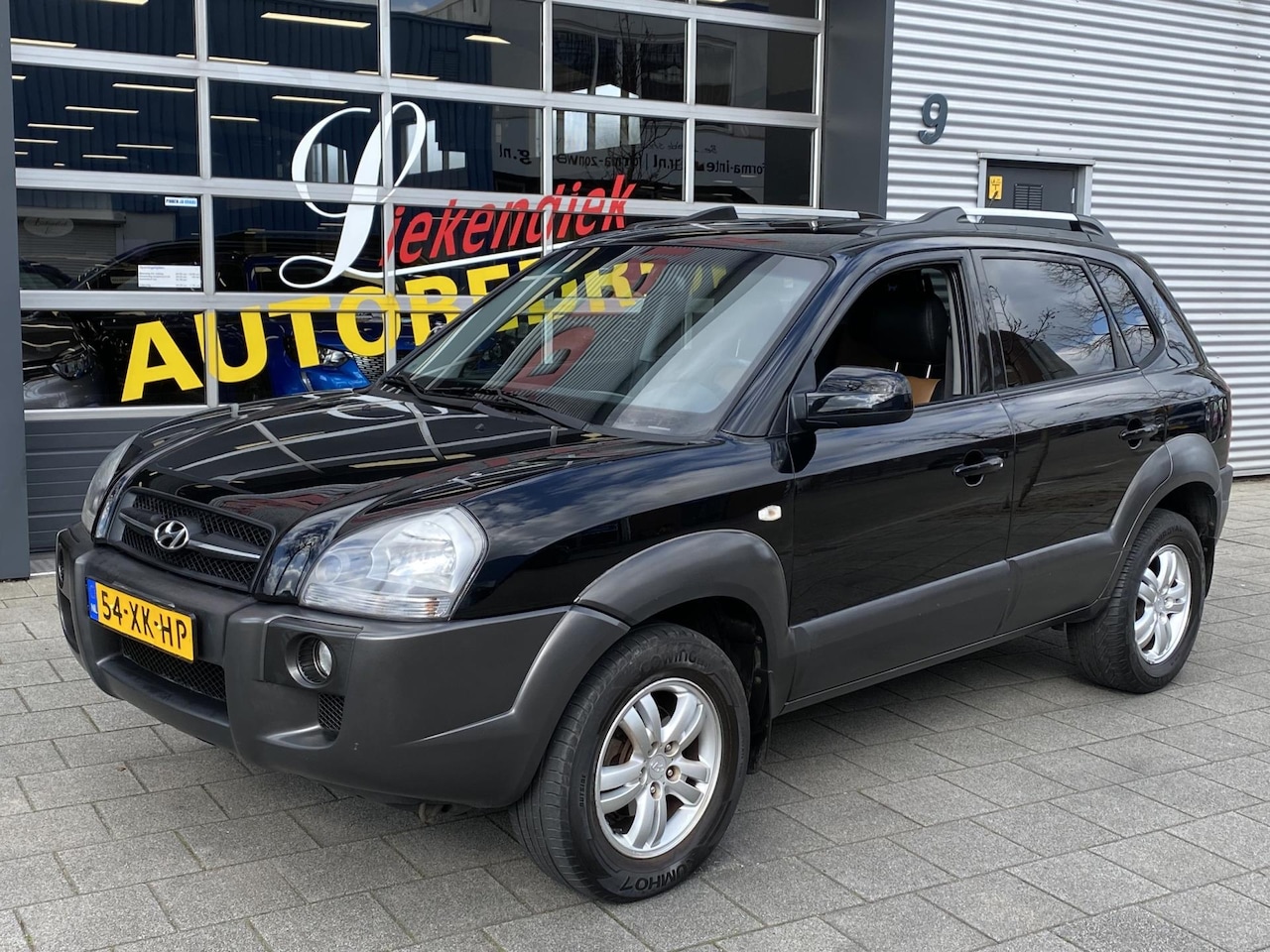 Hyundai Tucson - 2.0i Style Premium I Airco I Leer I Sport velgen I Dealer onderhouden - AutoWereld.nl