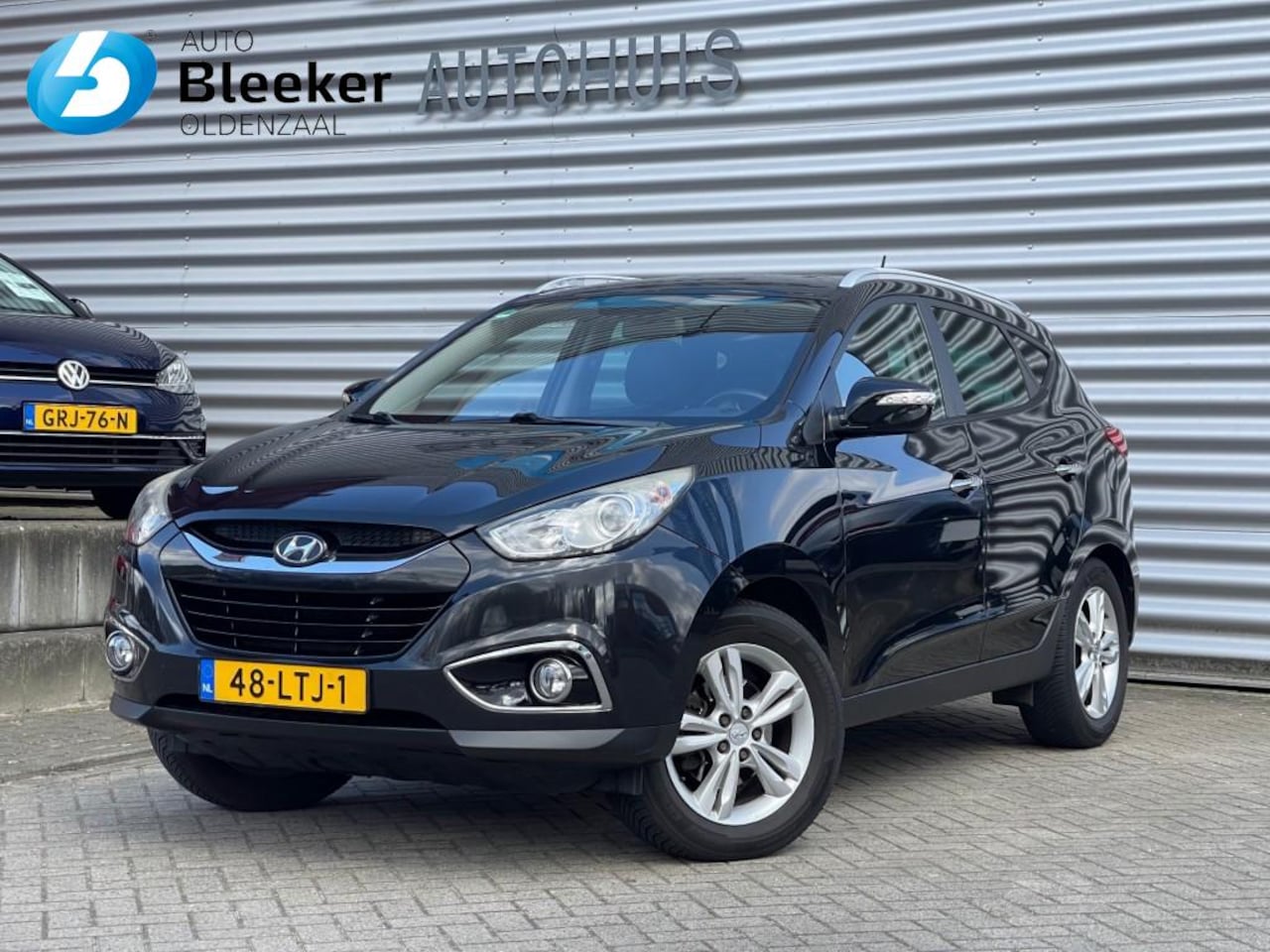 Hyundai ix35 - 2.0i Style 1900kg trekken Clima Cruise Navi - AutoWereld.nl