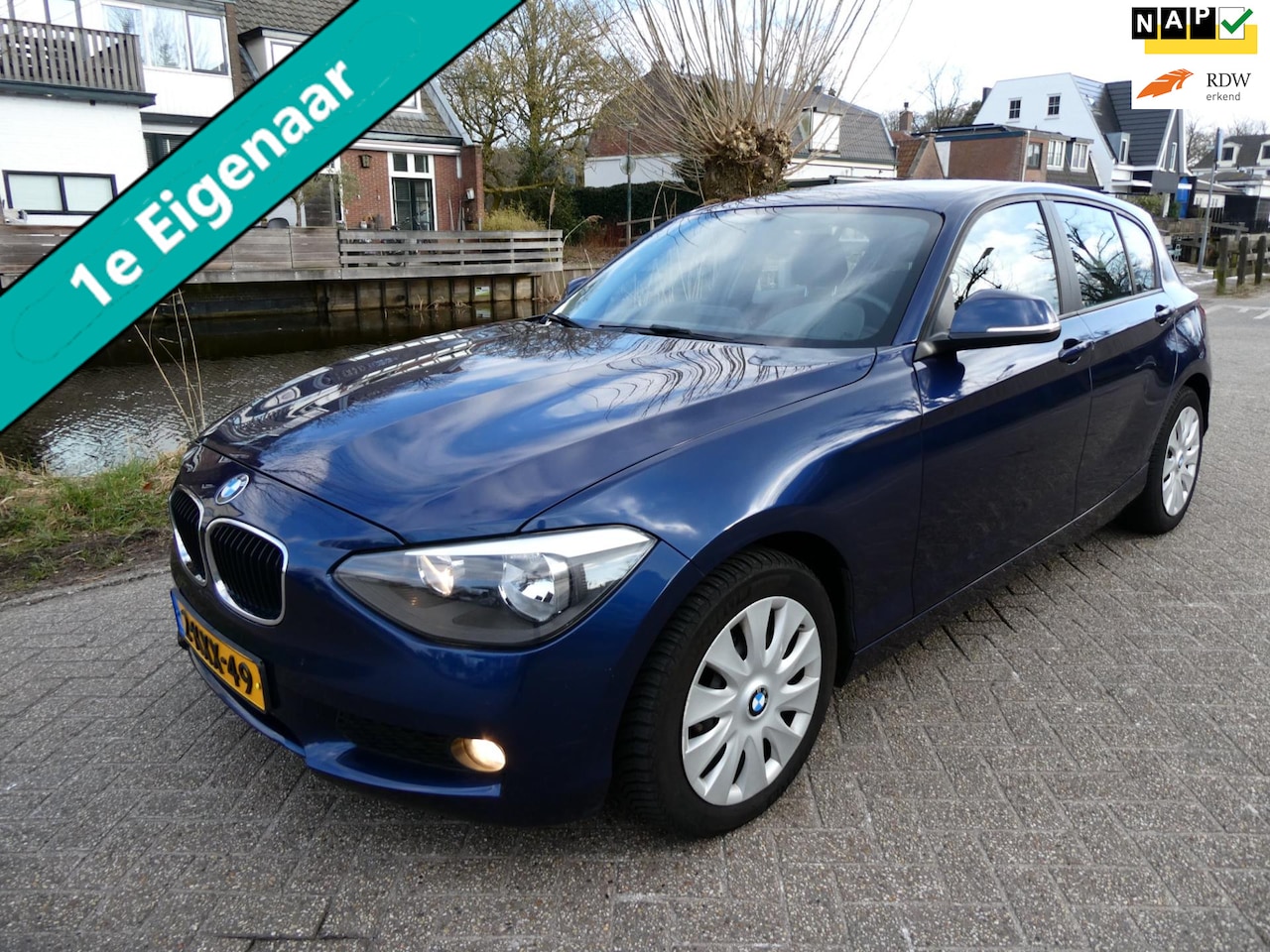 BMW 1-serie - 114i 5-deurs 1e eigenaar Airco Cruise Navi Zuinig A-Label - AutoWereld.nl