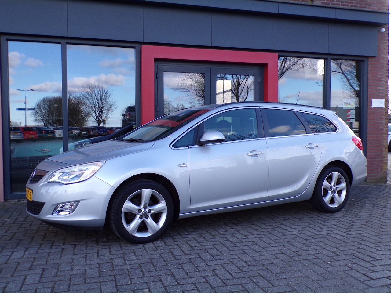 Opel Astra Sports Tourer - 1.4 Turbo Edition Airco Cruise Trekhaak NAP - AutoWereld.nl