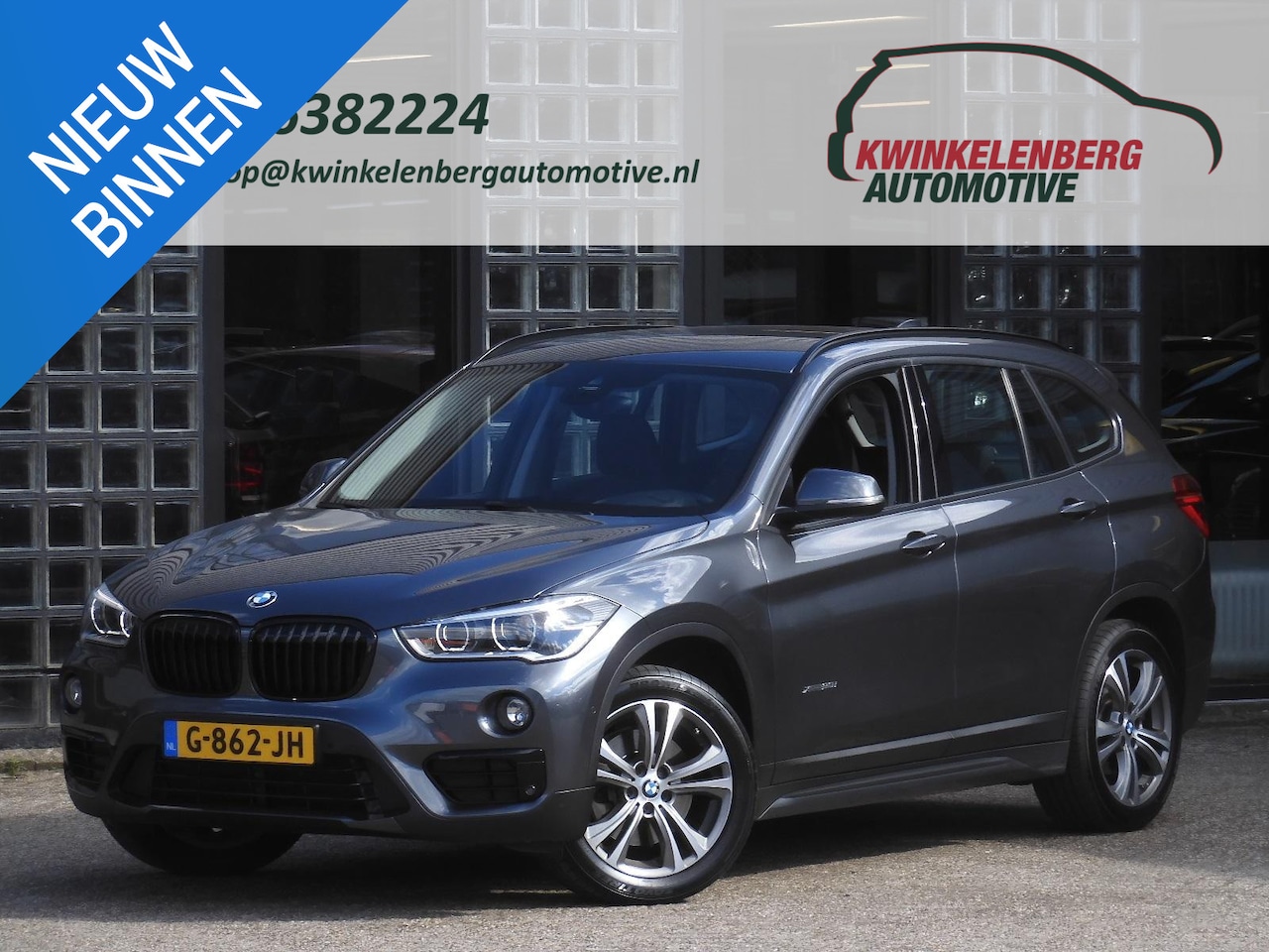 BMW X1 - xDrive20i SPORT LINE/ NAVI/ TREKHAAK/ PDC V+A/ 18INCH VELGEN/ SPORTSTOELEN - AutoWereld.nl