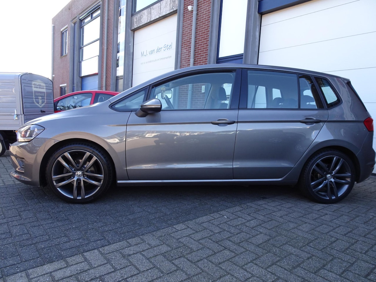 Volkswagen Golf Sportsvan - 1.0 TSI Trendline Navi|Airco|Carplay|PDC V+A - AutoWereld.nl