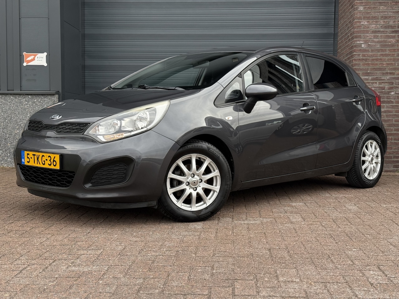 Kia Rio - 1.2 CVVT ComfortLine AIRCO | CRUISE | LM VELGEN | ELEK. RAMEN | APK 2026! - AutoWereld.nl