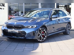 BMW 3-serie Touring - 330e High Executive M Sport Automaat / Panoramadak / Sportstoelen / Adaptieve LED / Parkin