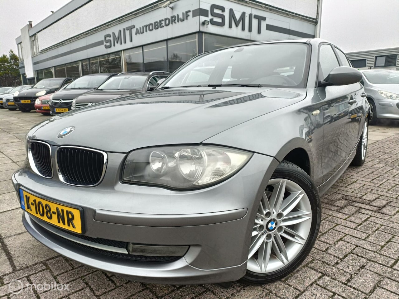 BMW 1-serie - 118i 5DRS/PDC/CC/Stoelverwarming - AutoWereld.nl