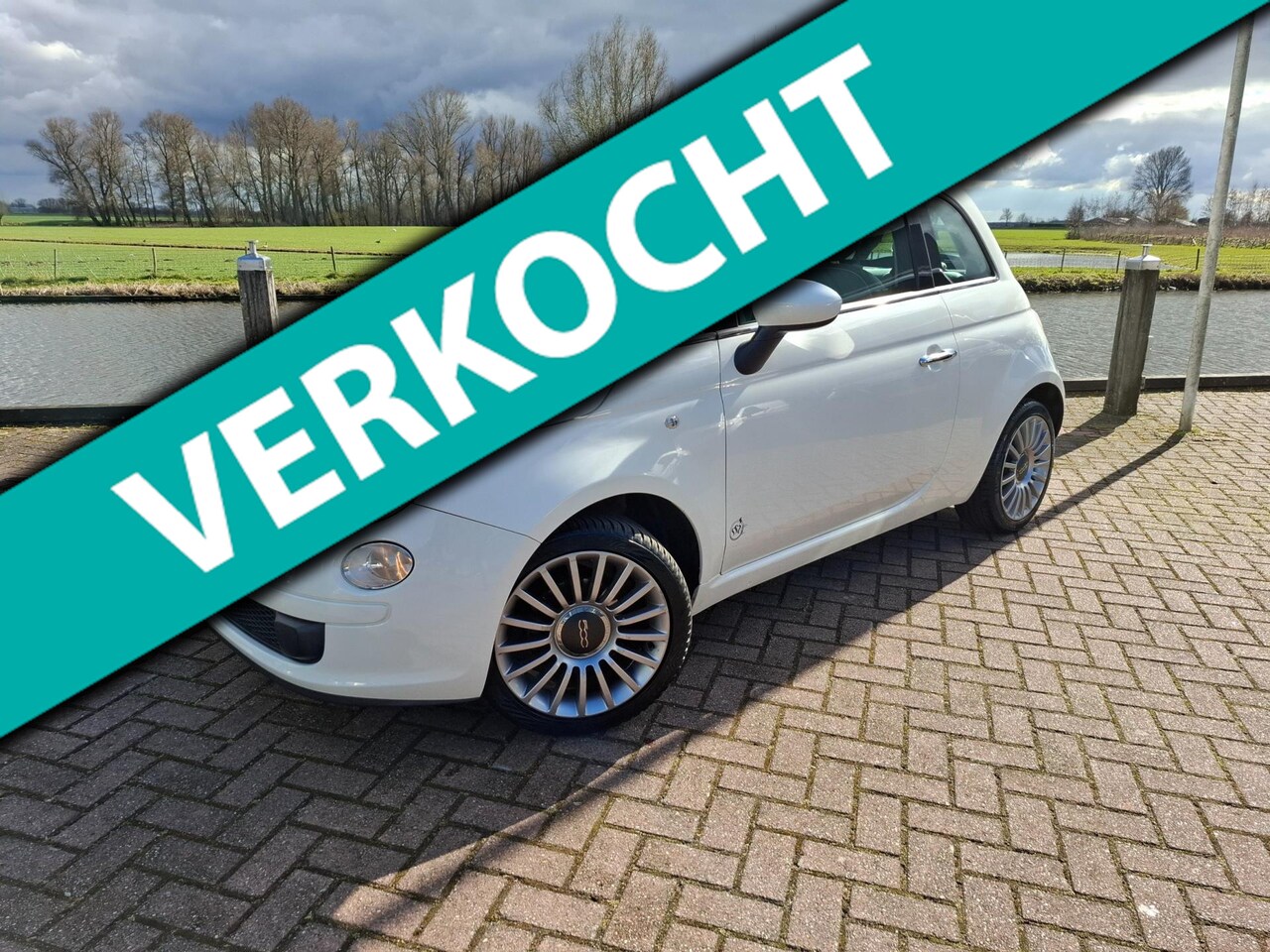 Fiat 500 - 1.2 Lounge Panoramadak Airco AllSeason banden Isofix - AutoWereld.nl