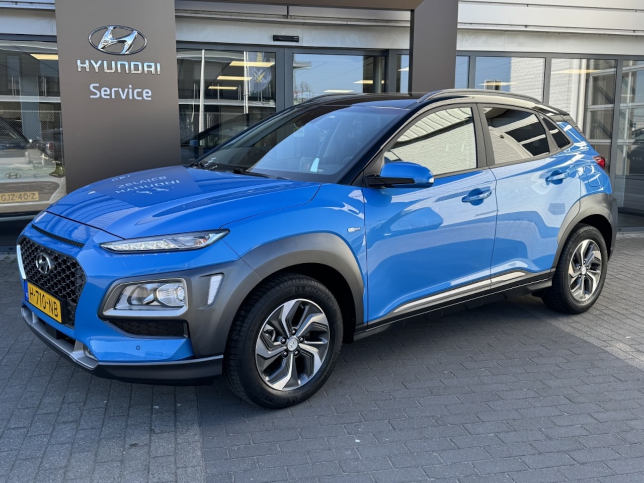 Hyundai Kona - 1.6 GDI HEV Fashion | Trekhaak afn. 1300kg! | Navigatie | Achter - AutoWereld.nl