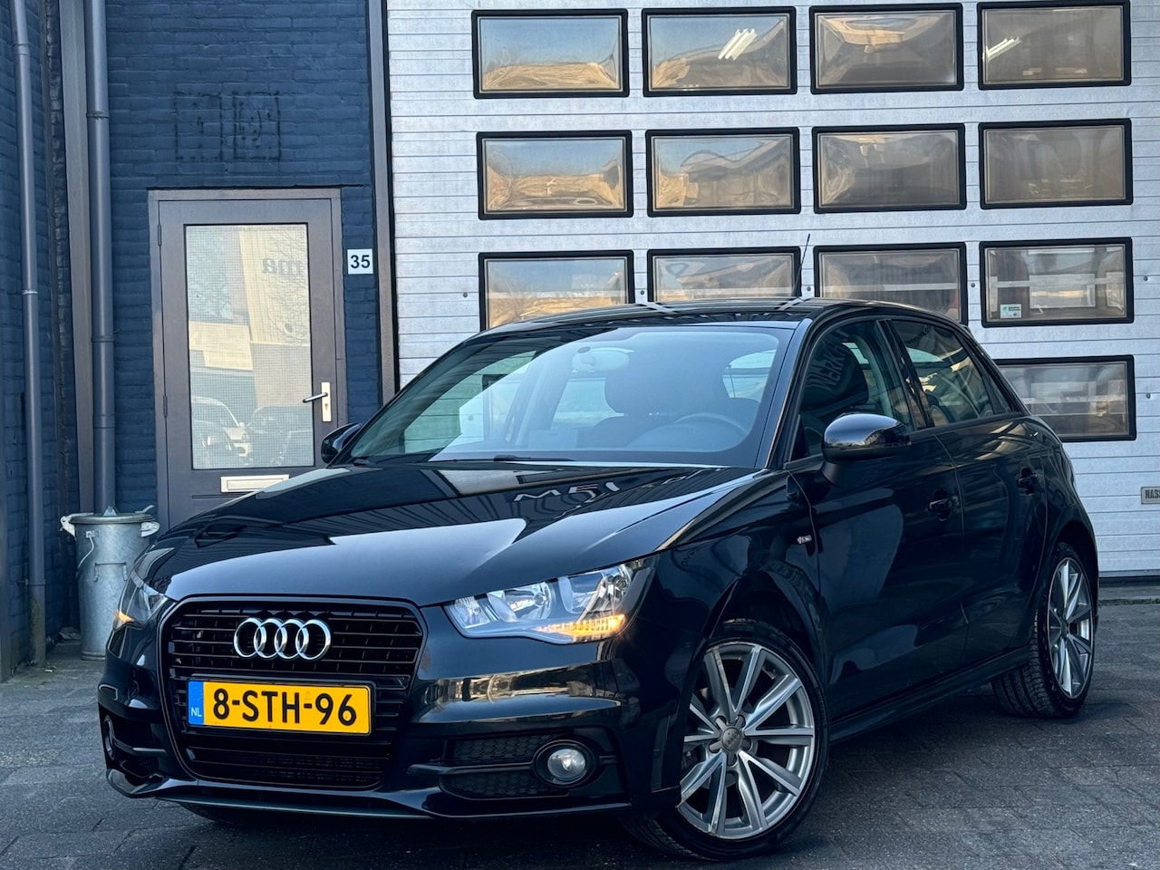 Audi A1 Sportback - 1.2 TFSI Admired | Airco | Navi | Cruise | 5-DRS | S-Line | N.A.P - AutoWereld.nl