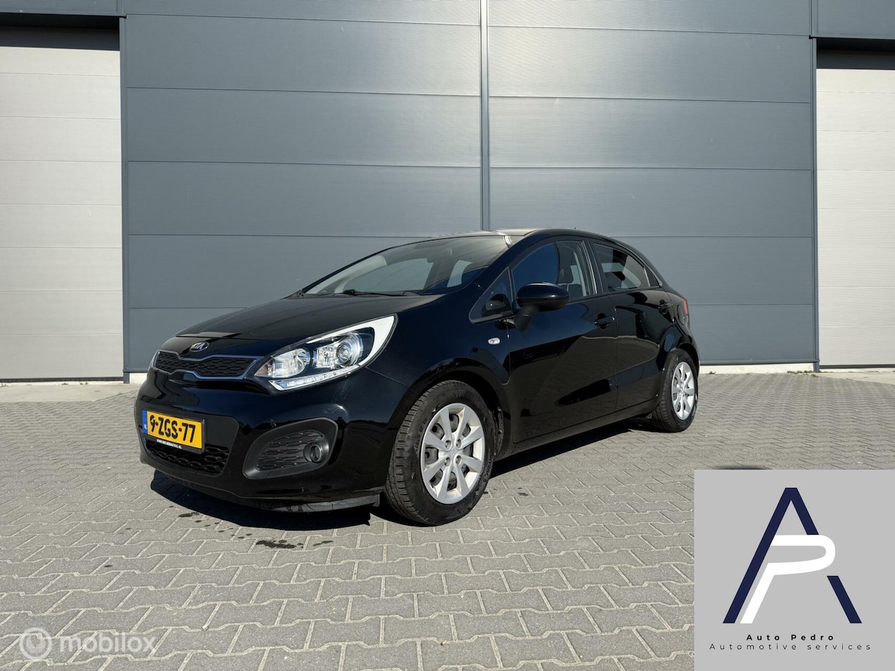 Kia Rio - 1.2 CVVT ComfortLine airco zwart hatchback - AutoWereld.nl