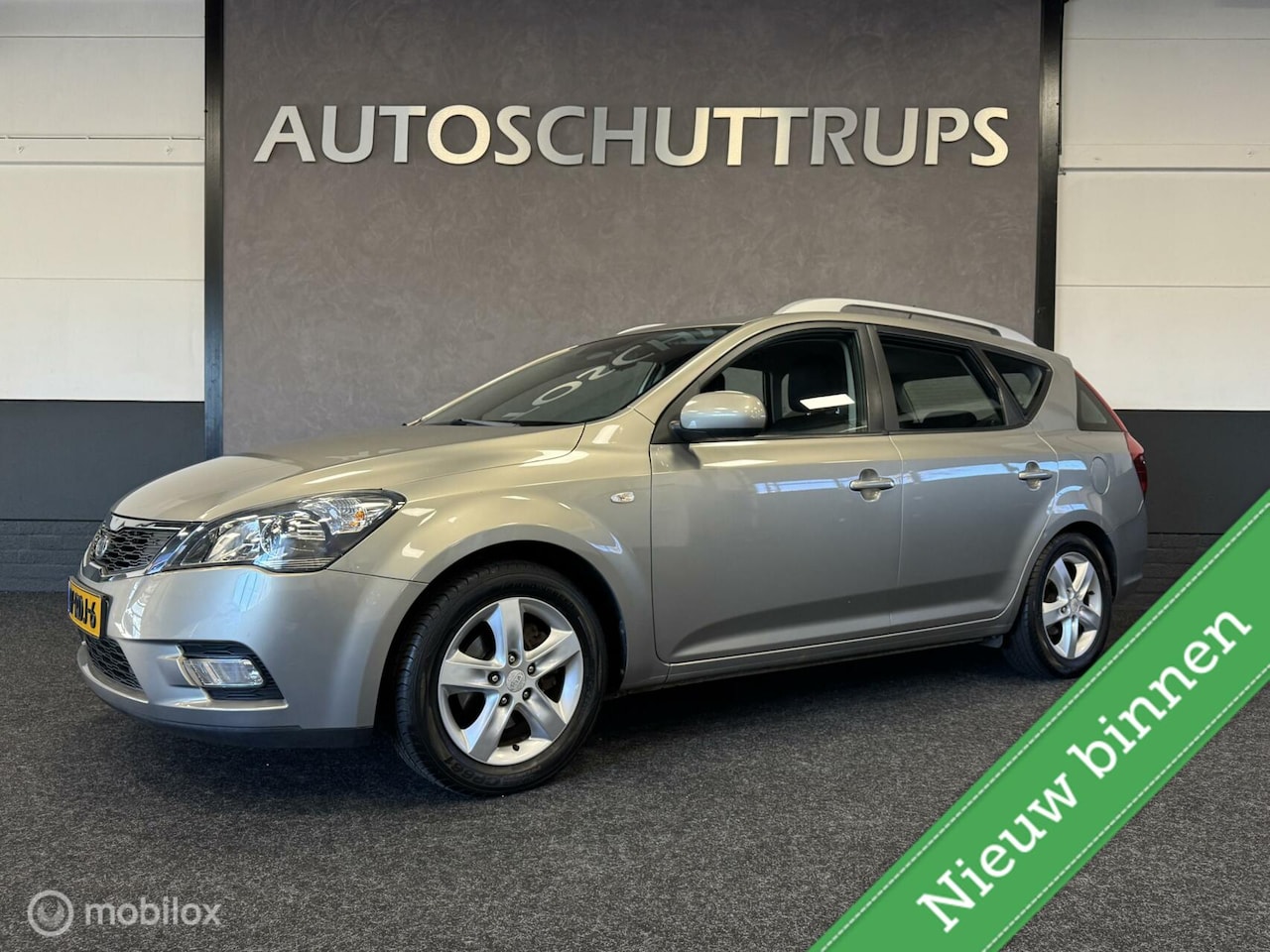 Kia Cee'd Sporty Wagon - 1.4 CVVT NAVI / AIRCO / CRUISE / CAMERA / TREKHAAK - AutoWereld.nl