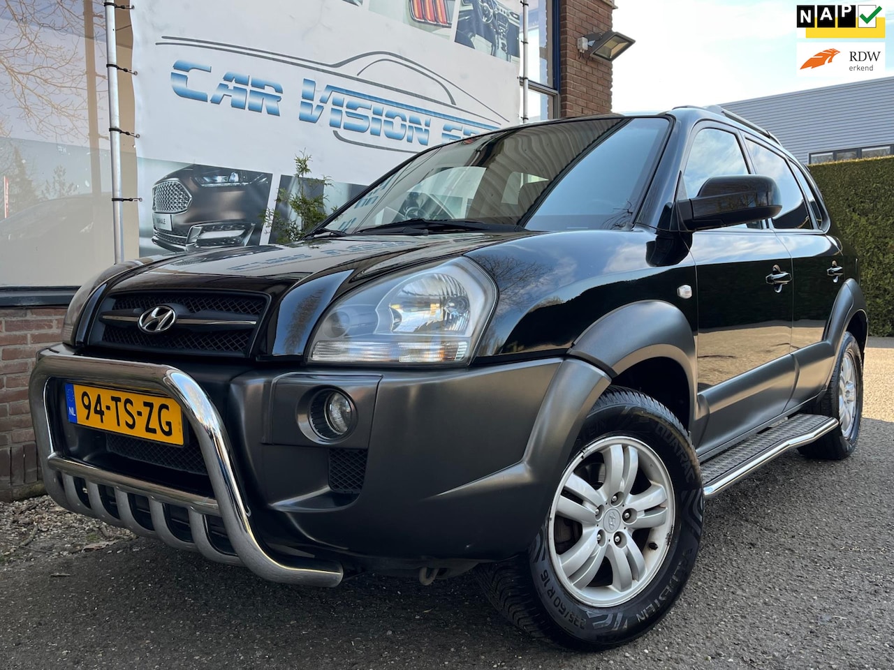 Hyundai Tucson - 2.0i Style Premium|Airco|Leder|Cruise|Bull/Side-bars| - AutoWereld.nl