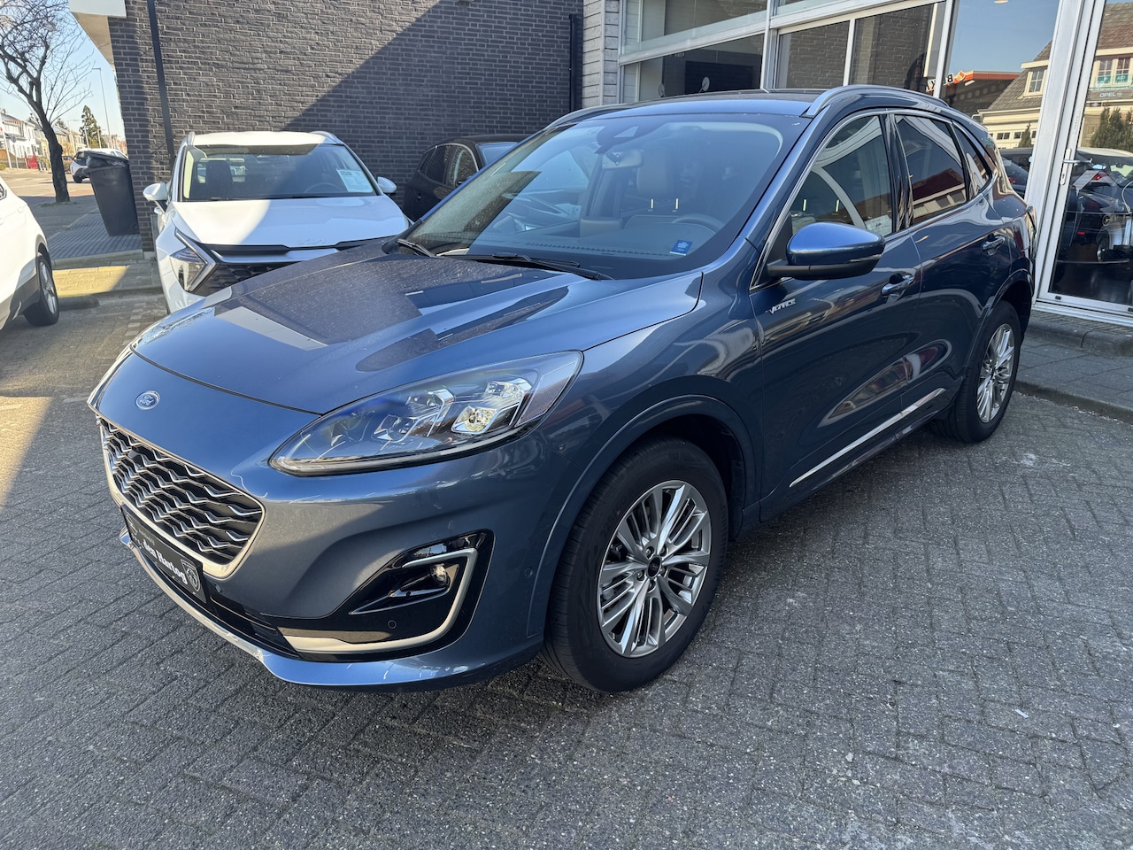 Ford Kuga - 2.5 FHEV Titanium Hybride Leder/360 camera/Zelf inparkeren/B&O. - AutoWereld.nl