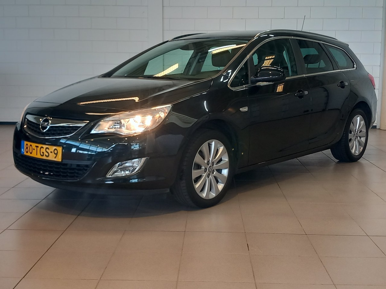 Opel Astra Sports Tourer - 1.4 Turbo Cosmo 140pk | Cruise control | Electronic climate controle | Lichtmetalen velgen - AutoWereld.nl