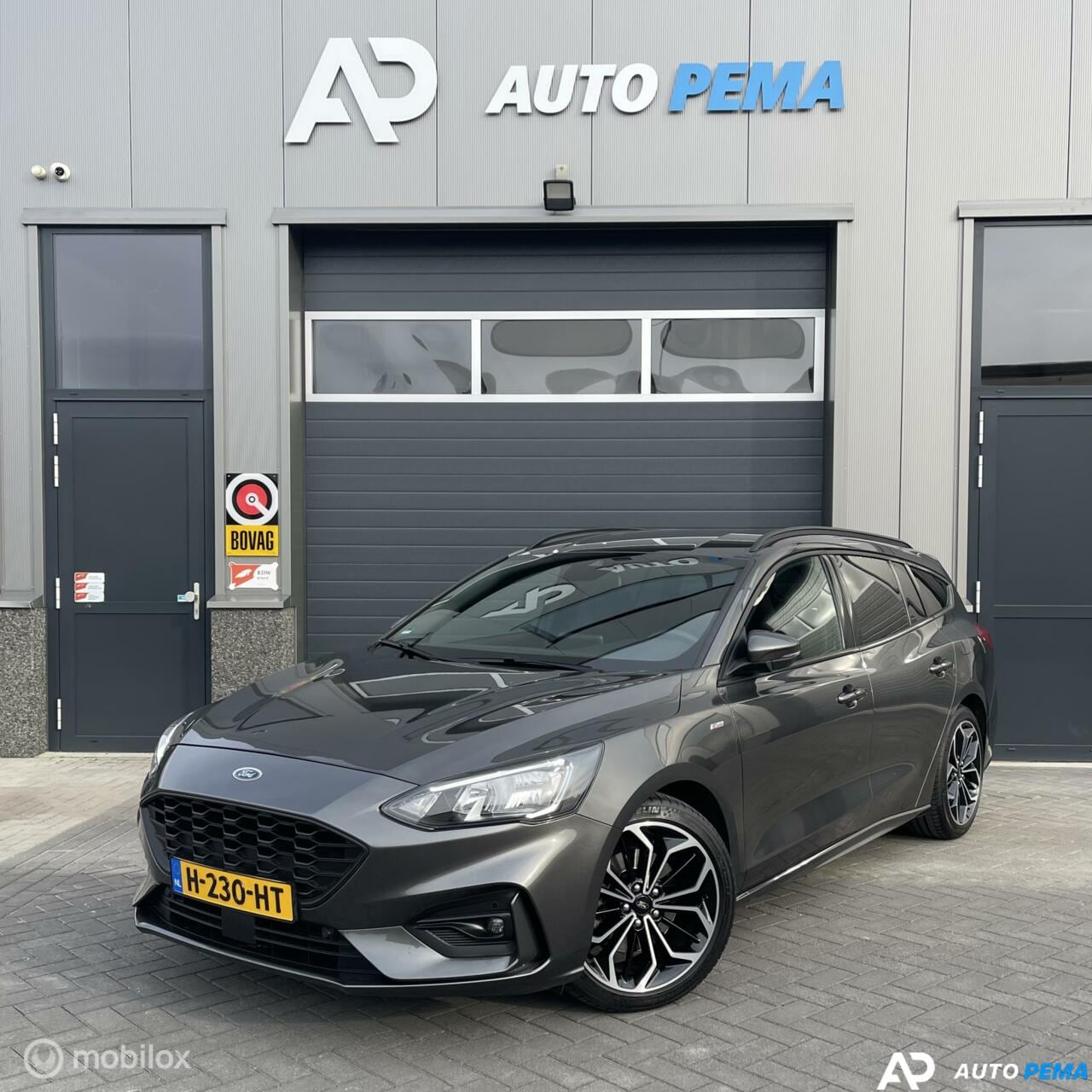 Ford Focus Wagon - Ford Focus 1.0 EcoBoost ST-Line 125PK NAVI/PDC/18'' - AutoWereld.nl