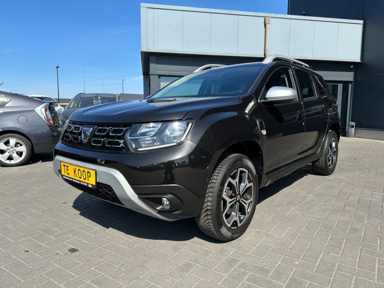 Dacia Duster - 1.3TCe Prestige Zwart, 1e eigenaar! Navigatie, airco - AutoWereld.nl