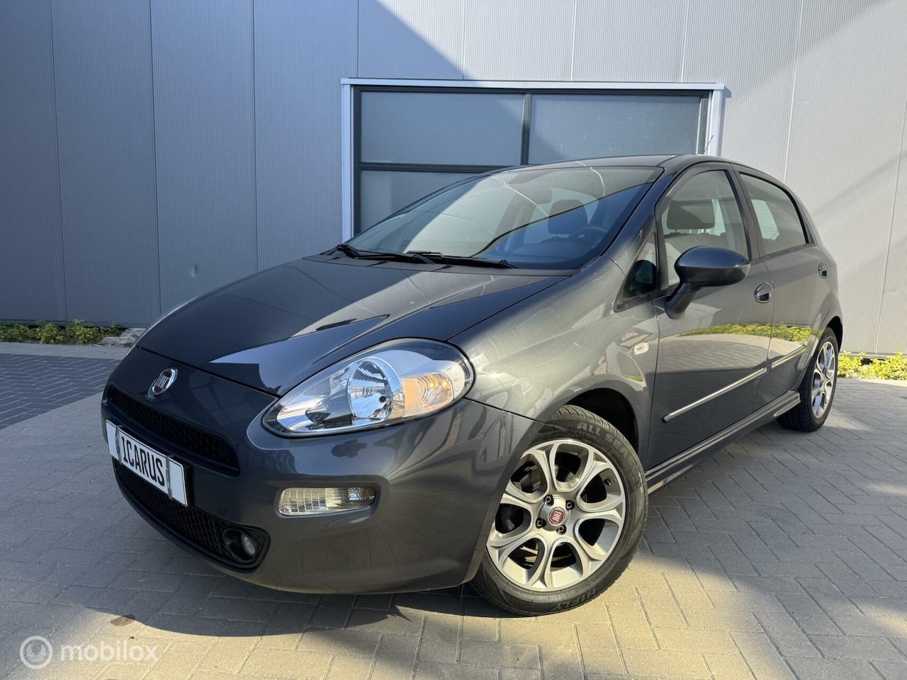 Fiat Punto Evo - 0.9 TwinAir Lounge apk|cruise|airco|nap| - AutoWereld.nl