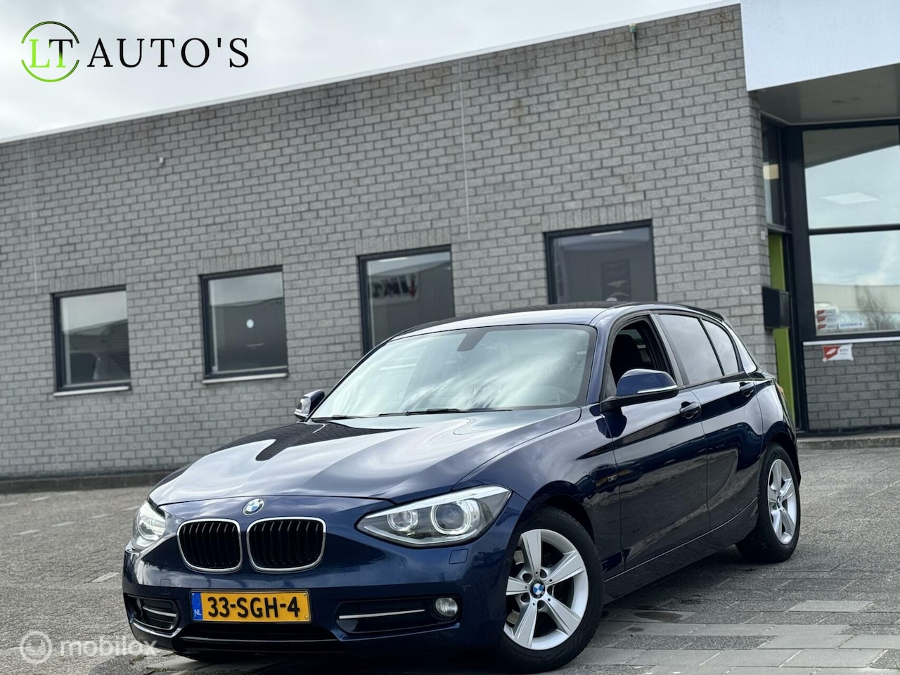 BMW 1-serie - 116i Business|Xenon Camera Navi Clima Cruise - AutoWereld.nl