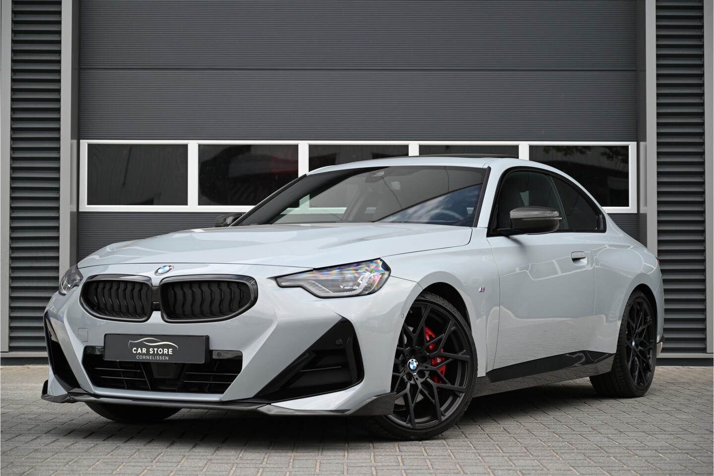 BMW 2-serie Coupé - 220i M-PERFORMANCE / SCHUIFDAK / M-SEATS / CARBON / MEMORY / CAMERA / 20" / UNIEK - AutoWereld.nl