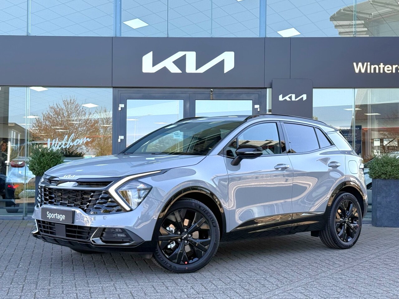 Kia Sportage - 1.6 T-GDi MHEV Dark Edition Stoel/Stuur Wiel Verwarming + Camera + Navi + Adaptive Cruise - AutoWereld.nl