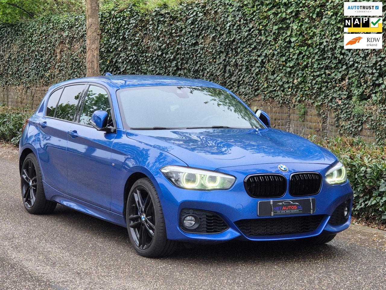BMW 1-serie - 120i Edition M Sport Camera CarPlay Adaptieve LED Cruise Navi LCI Shadow High Executive - AutoWereld.nl