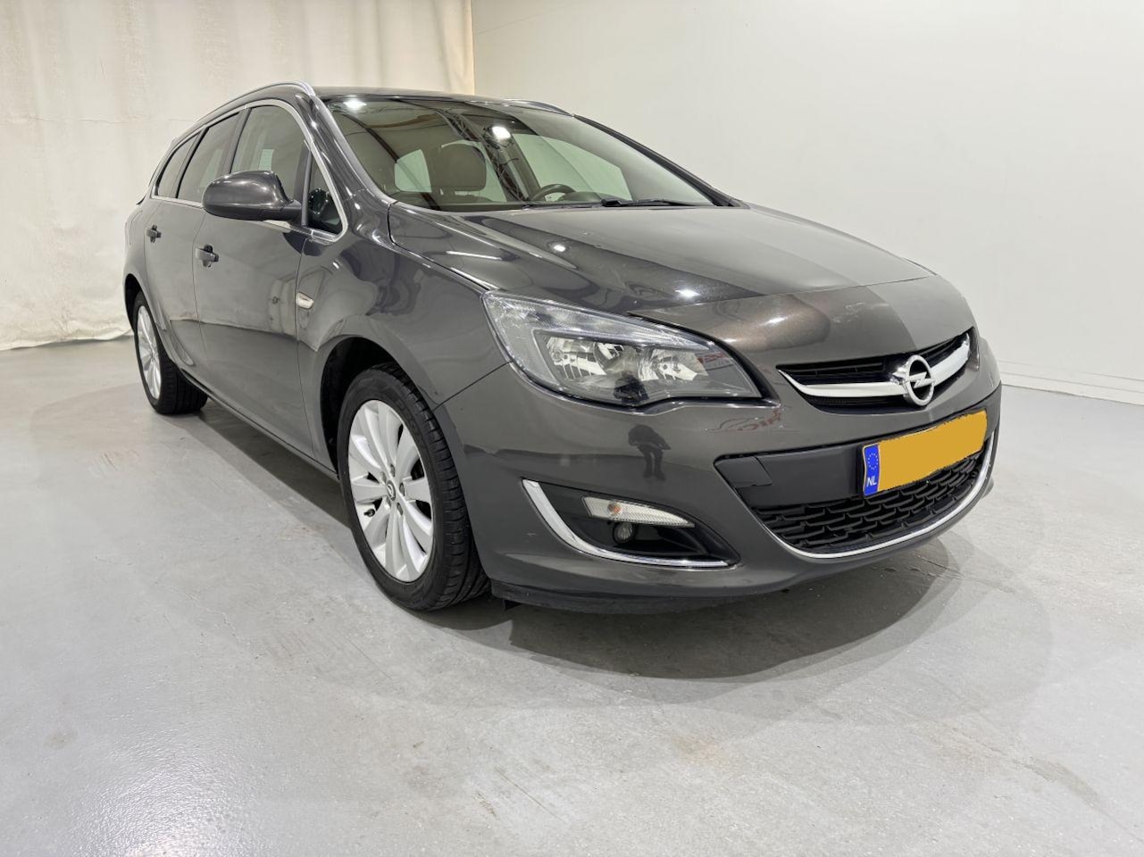 Opel Astra Sports Tourer - 1.4 Edition Navi/Clima - AutoWereld.nl