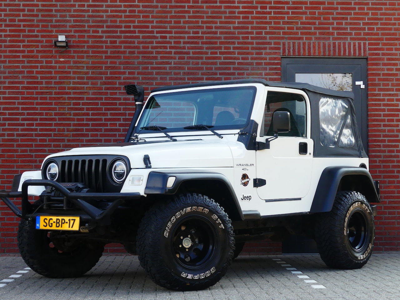 Jeep Wrangler - 4.0i Sofftop / Leer - AutoWereld.nl