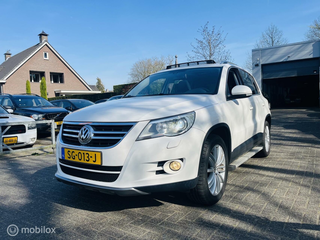 Volkswagen Tiguan - 2.0 TSI Sport&Style 4Motion Automaat / Pano-dak / Clima / PDC / Xenon - AutoWereld.nl