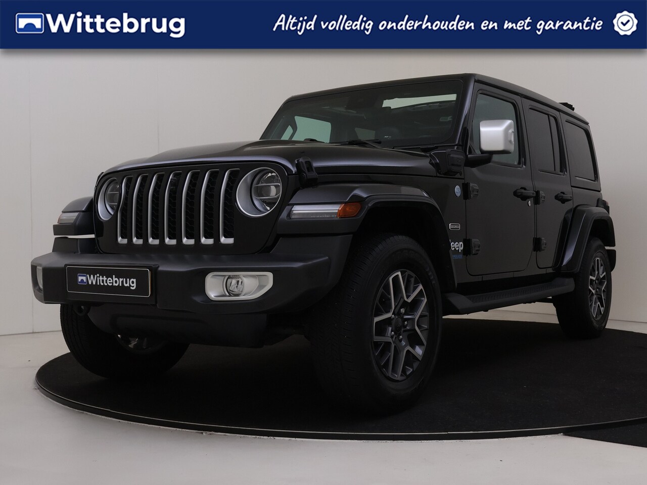 Jeep Wrangler Unlimited - 4xe 380PK Sahara | Leder Interieur | 4WD | Trekhaak | Parkeerhulp | Cabrio soft top - AutoWereld.nl