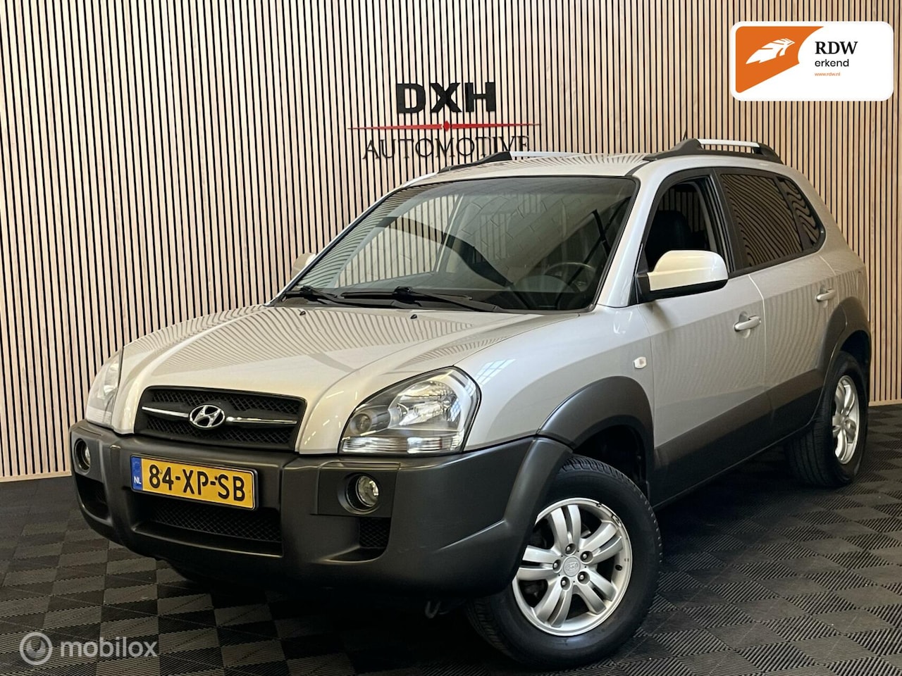 Hyundai Tucson - 2.0i Premium LEDER TREKHAAK PDC CRUIS CLIMA - AutoWereld.nl