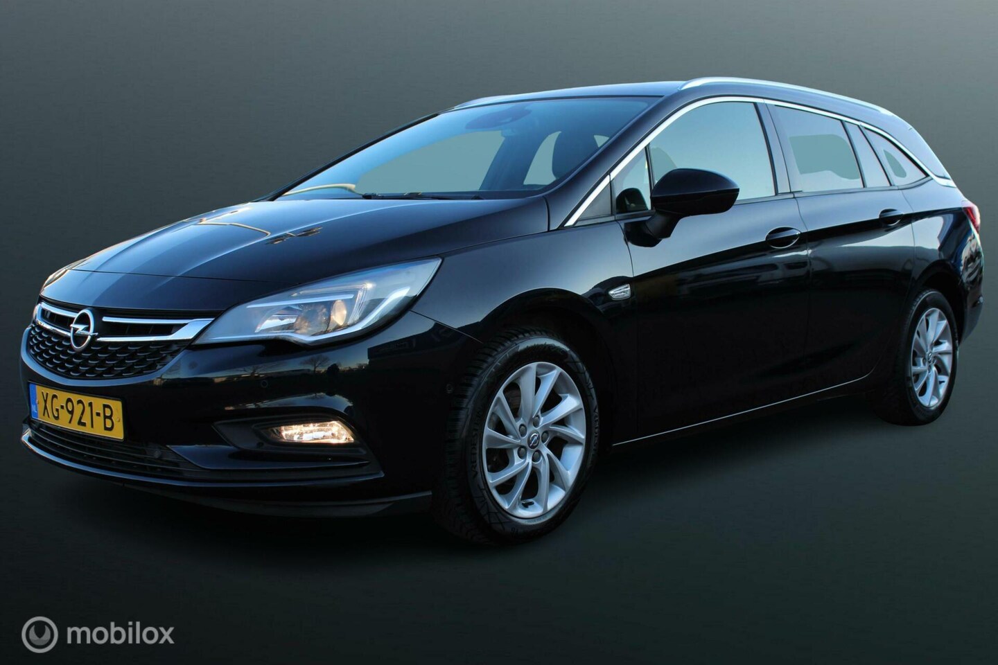 Opel Astra Sports Tourer - 1.0 Business Executive 1.0 Business Executive, Trekhaak, Pdc voor + achter, Clima, Navi, Donker glas, Cruise, App - AutoWereld.nl