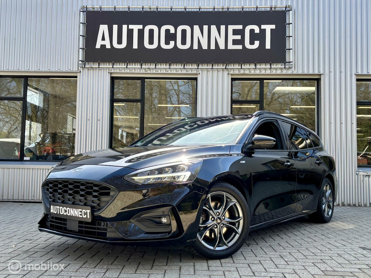 Ford Focus Wagon - 1.0 EcoBoost ST Line. NAVI, CRUISE, 1E EIGENAAR. - AutoWereld.nl