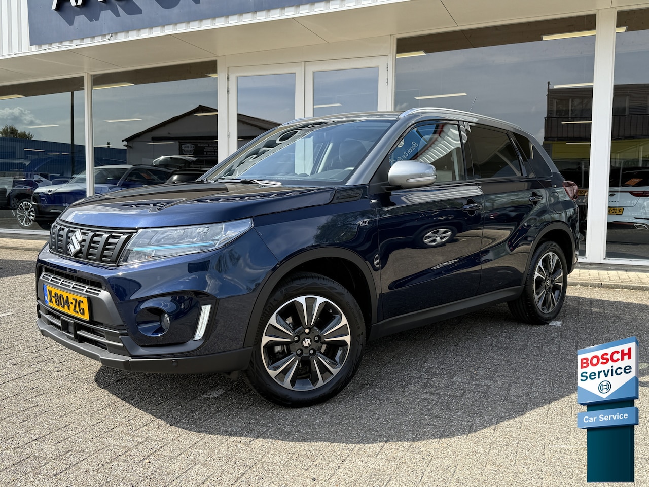Suzuki Vitara - 1.4 Boosterjet Style Rhino Edition Smart Hybrid | LED | Keyless | Apple Carplay | Camera | - AutoWereld.nl