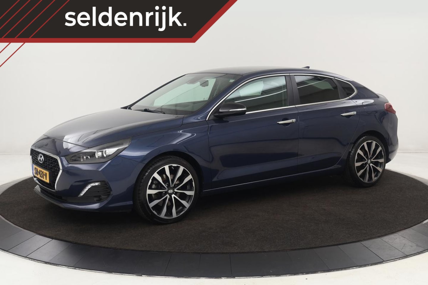 Hyundai i30 Fastback - 1.4 T-GDI Premium | Trekhaak | Carplay | Full LED | Half leder | Keyless | Navigatie | Cam - AutoWereld.nl