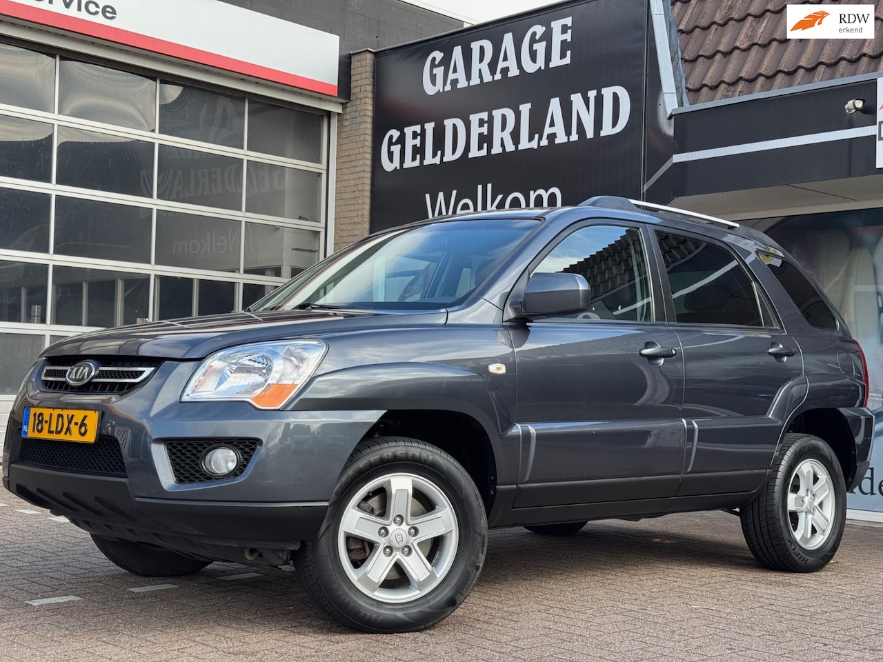 Kia Sportage - 2.0 CVVT X-tra | Trekhaak | Cruise | Climate | Flex | Full - AutoWereld.nl