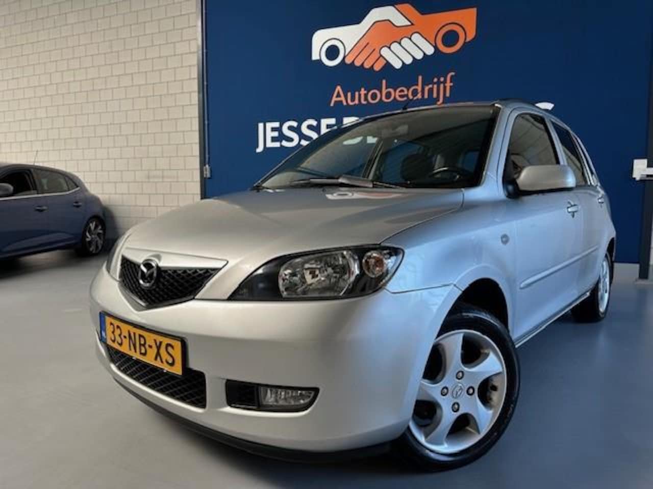 Mazda 2 - 1.4 Touring 1.4 Touring,bj.2003,kleur:grijs.Airco,5 deurs,trekhaak,sportvelgen,APK 05/206,NAP met 2133 - AutoWereld.nl